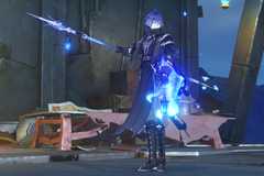 Flins, a pale man with a dark wardrobe and blue hair, stands with a polearm in Genshin Impact